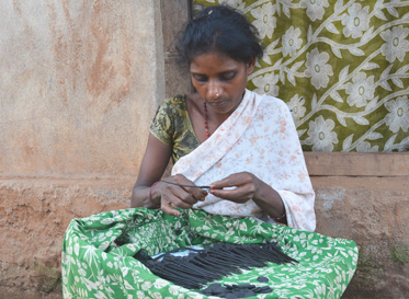 Mounabati making lockets and hair pins using Dhokra craft