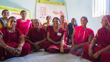 Self-help group members get together to discuss the technicalities of building toilets in their village
