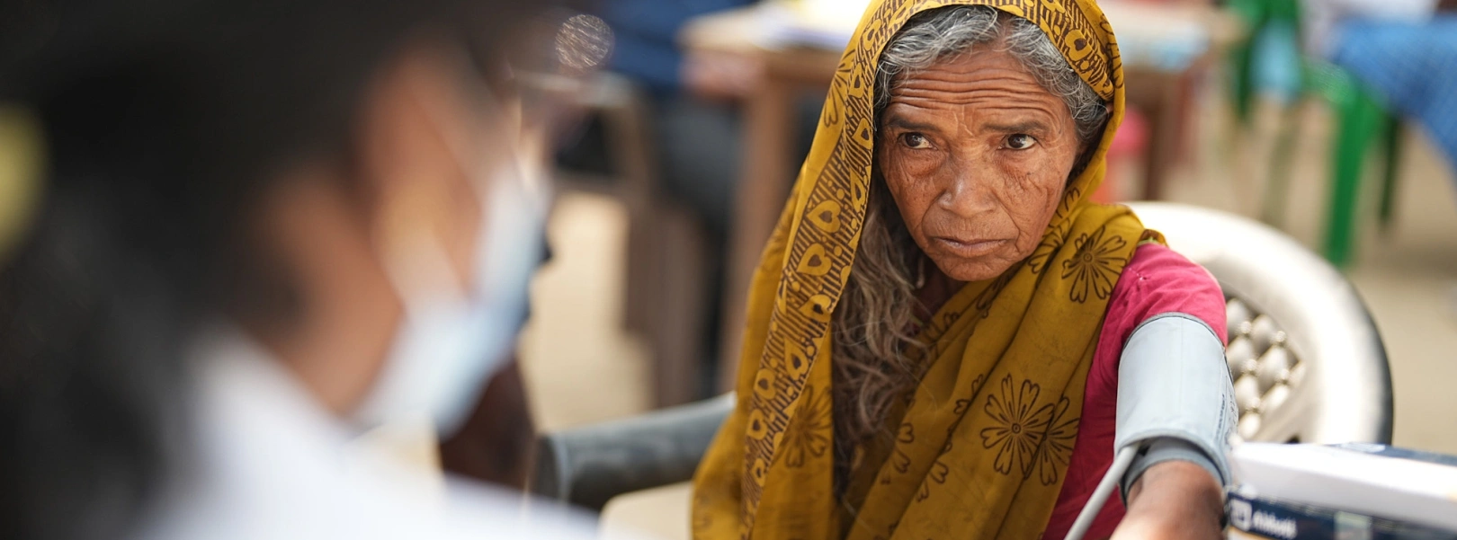 Older woman receiving a community health screening