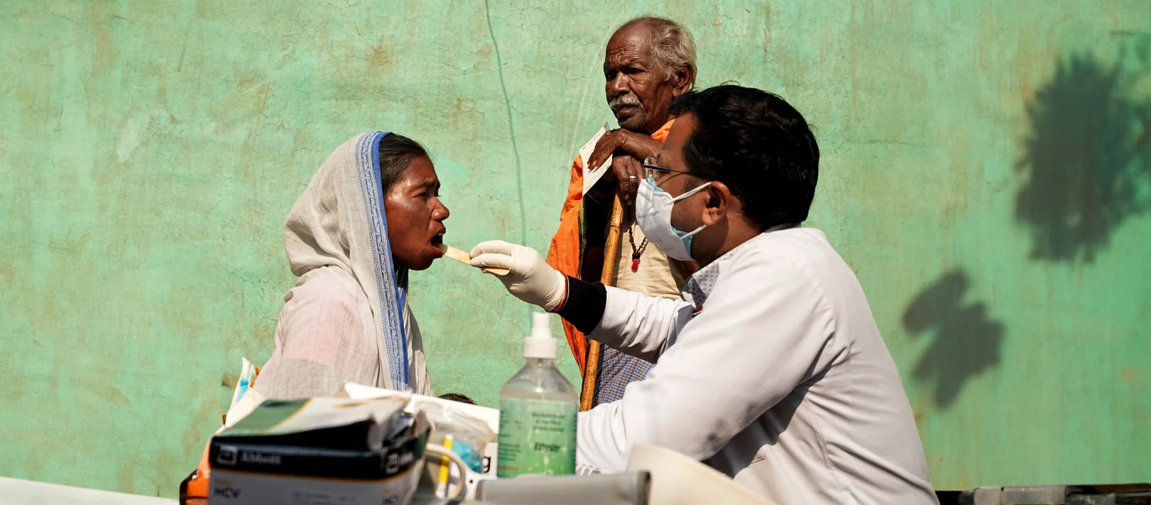 Healthcare worker conducting an oral health check-up