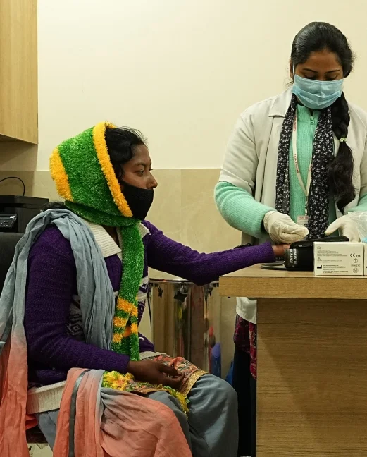 Woman receiving a primary healthcare consultation